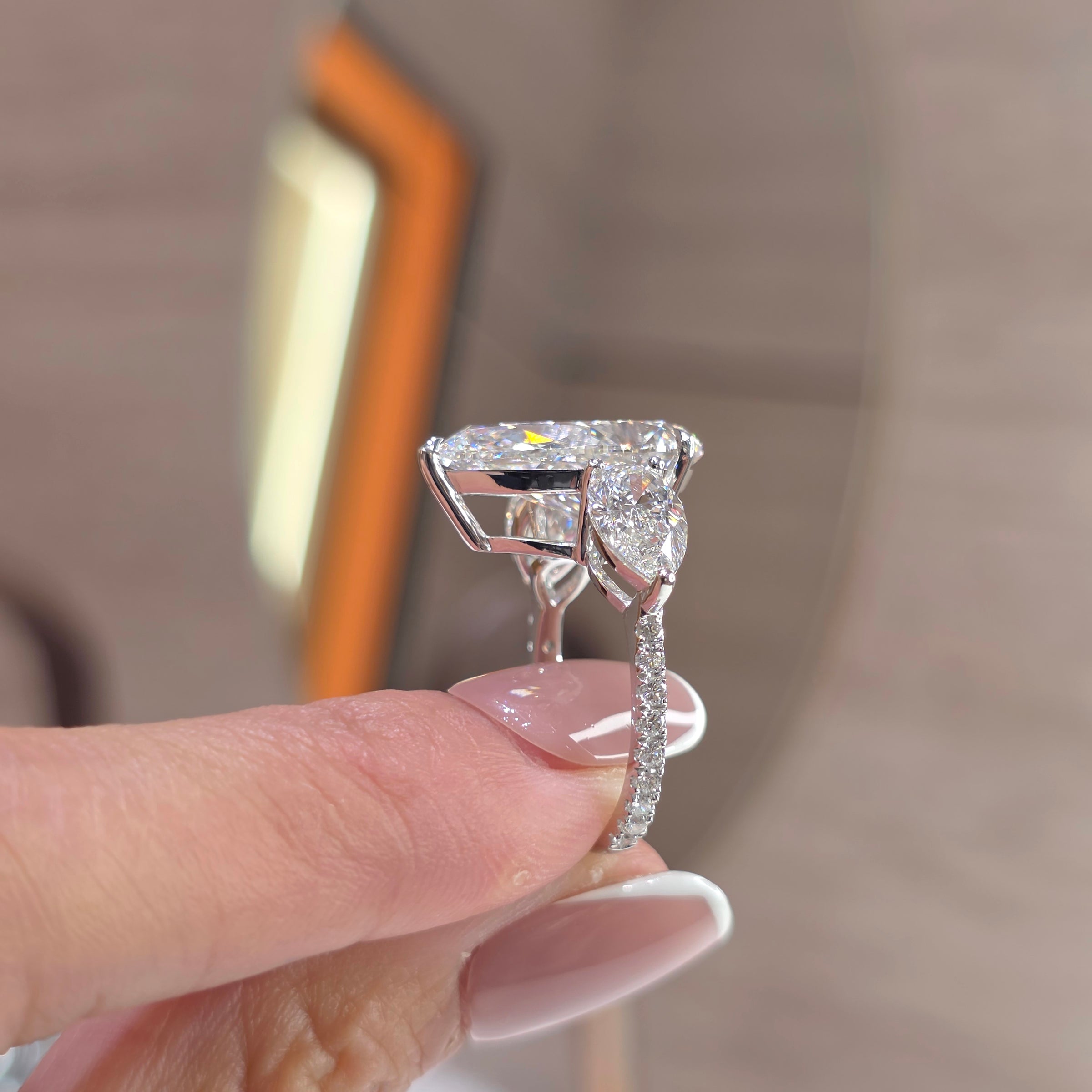 7 Carat Pear Lab-Grown Diamond Trilogy Ring with 2 Carat Pear Side Diamonds & Pavé Band – 18K Gold