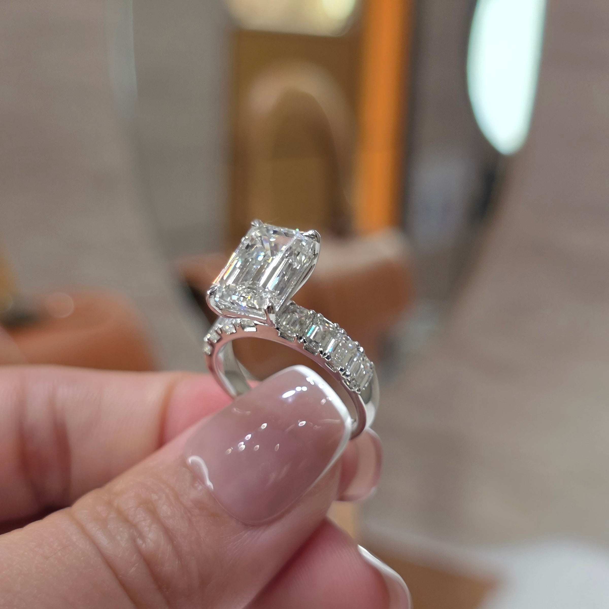 4 Carat Emerald Cut Lab Grown Diamond Solitaire Ring with Emerald Diamond Band in 18K Gold | Emerald Side Stones