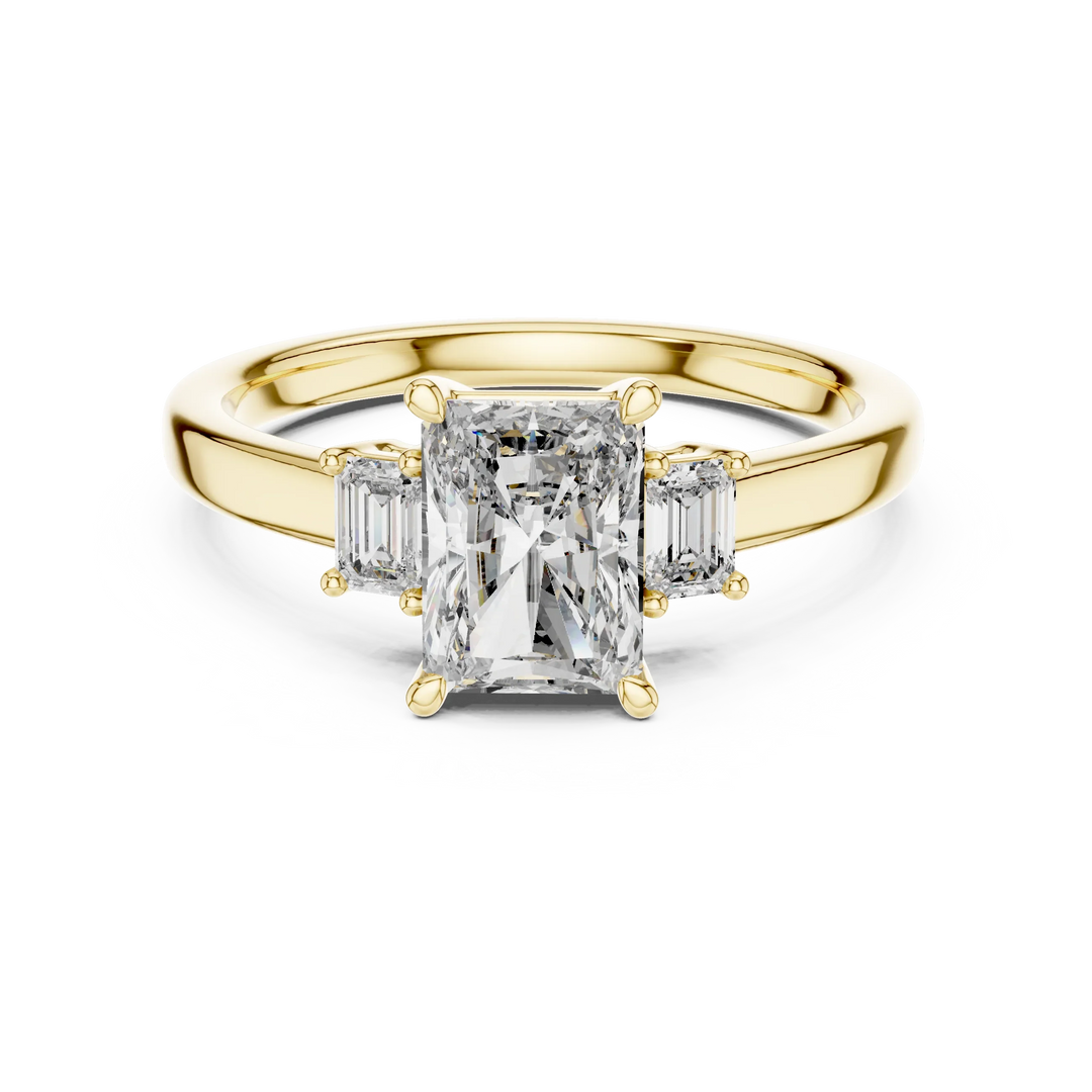 Elegant emerald-cut diamond ring with side stones in yellow gold, showcasing sustainable luxury.