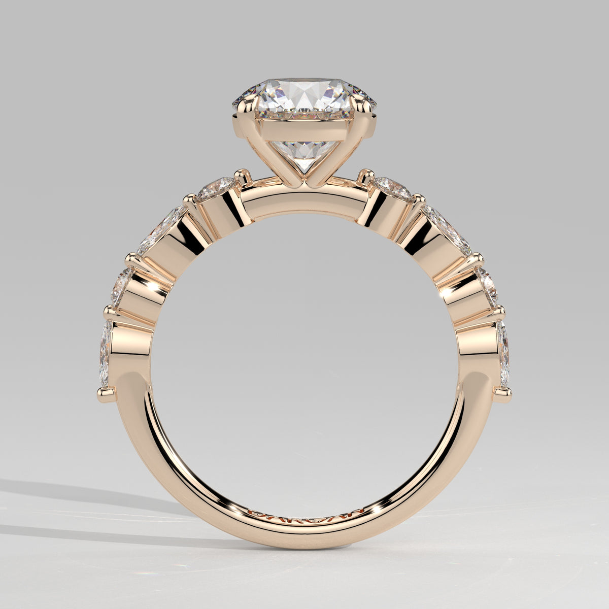 Orbis Round lab-grown diamond solitaire ring with marquise and round side stones in 18K rose gold, front-on view of the band and setting