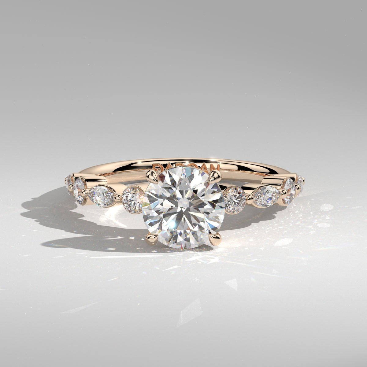 Orbis Round lab-grown diamond solitaire ring with marquise and round side stones in 18K rose gold, front view