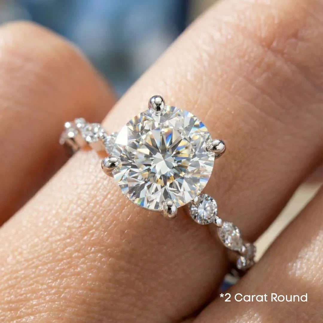 Orbis Round lab-grown diamond solitaire ring with marquise and round side stones in 18K white gold, worn on the finger, 2 carat round, real photo