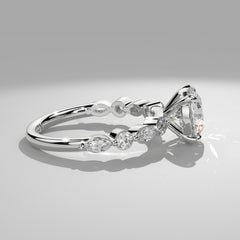 Orbis Round lab-grown diamond solitaire ring with marquise and round side stones in 18K white gold, side profile of marquise and round band