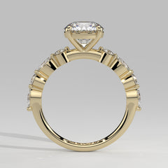 Orbis Round lab-grown diamond solitaire ring with marquise and round side stones in 18K yellow gold, front-on view of the band and setting