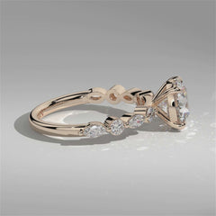 Video of Orbis Round lab-grown diamond solitaire ring with marquise and round side stones in 18K rose gold, 360-degree view